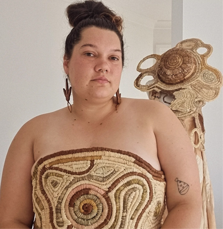    Ngaire Pakai is a proud Wiradjuri and Māori woman developing her artist practice on Awabakal Country. Her cultural connections and practices inform her artmaking, which spans multiple mediums including painting, digital art, weaving, and textiles, as she works as a multidisciplinary artist. She has a particular interest in Aboriginal weaving, which she learned through cultural revitalisation programs led by staunch Aboriginal women in the Hunter Region. 