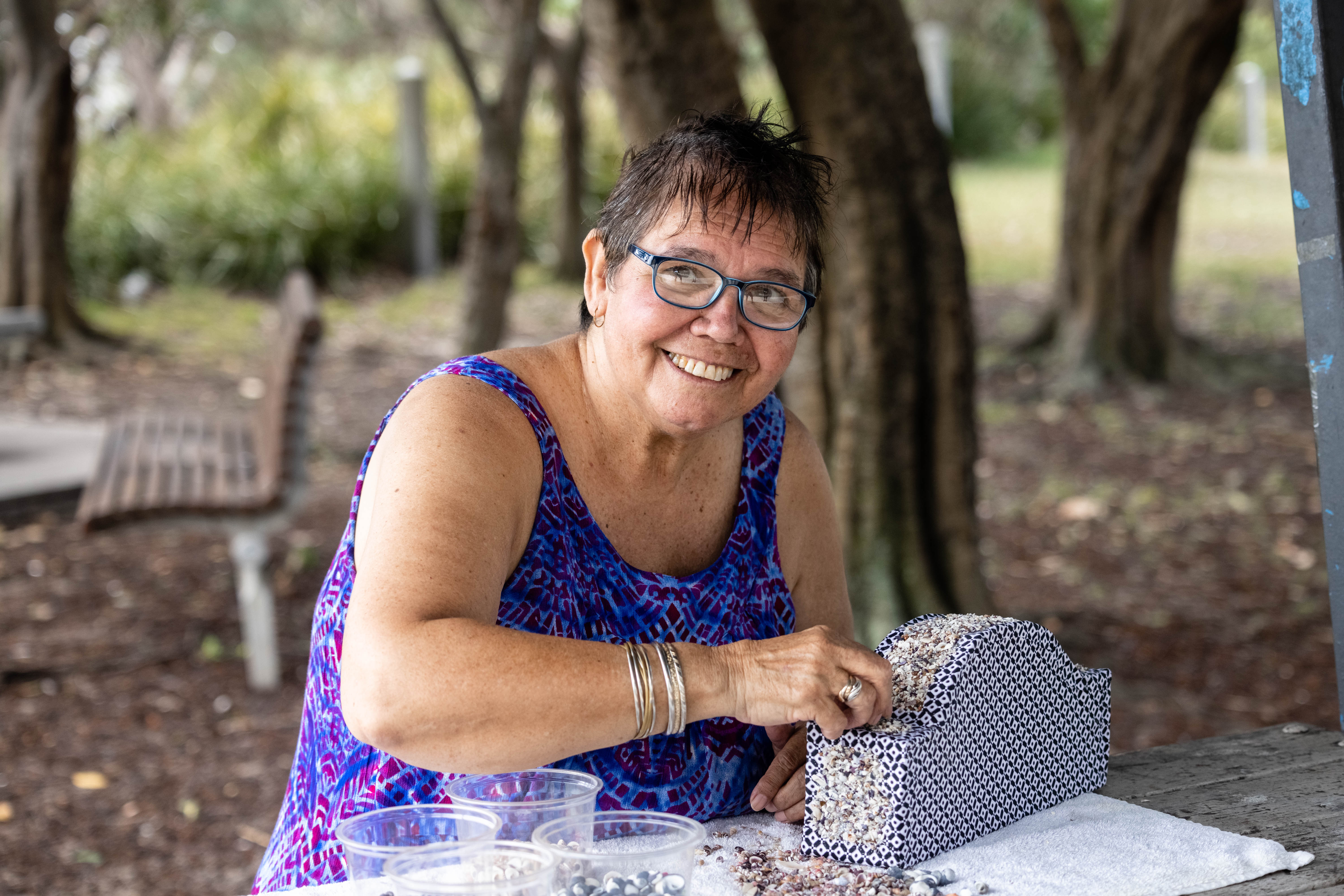 Aunty Maxine Ryan shellworking a shellwork artefact of the Sydney Opera House - traditional crafts from La Perouse area